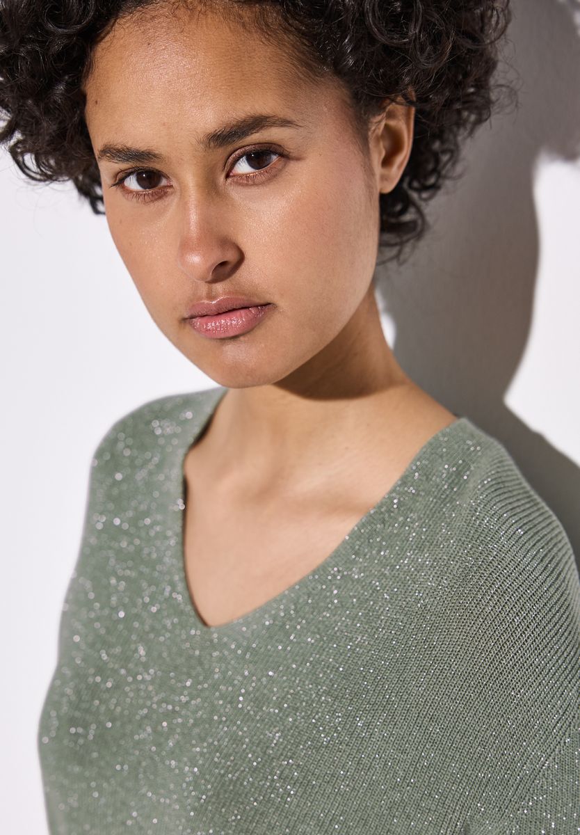 Glitzernder Pullover